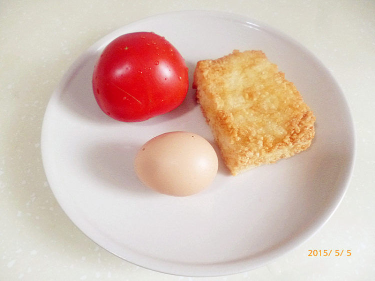 西红柿鸡蛋糍粑粥步骤1