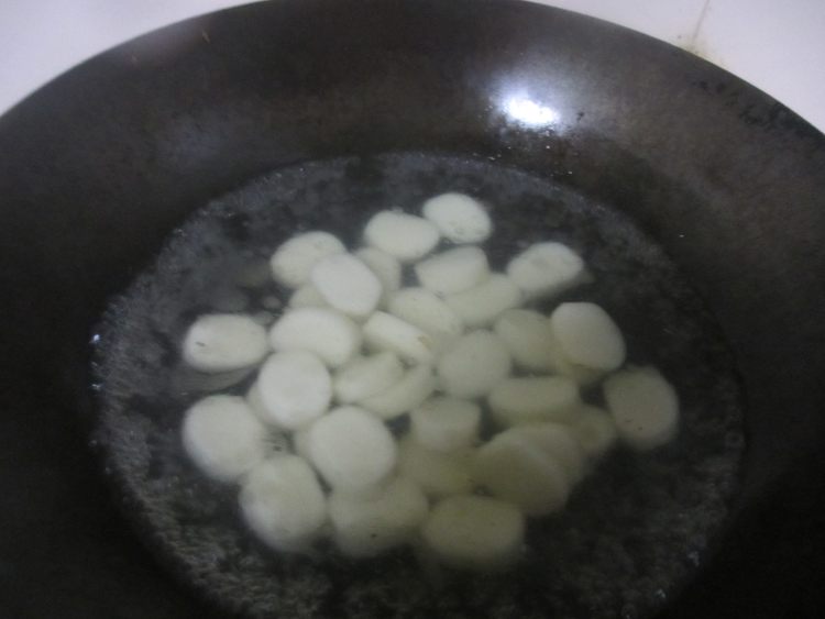 腊肉炒年糕步骤5