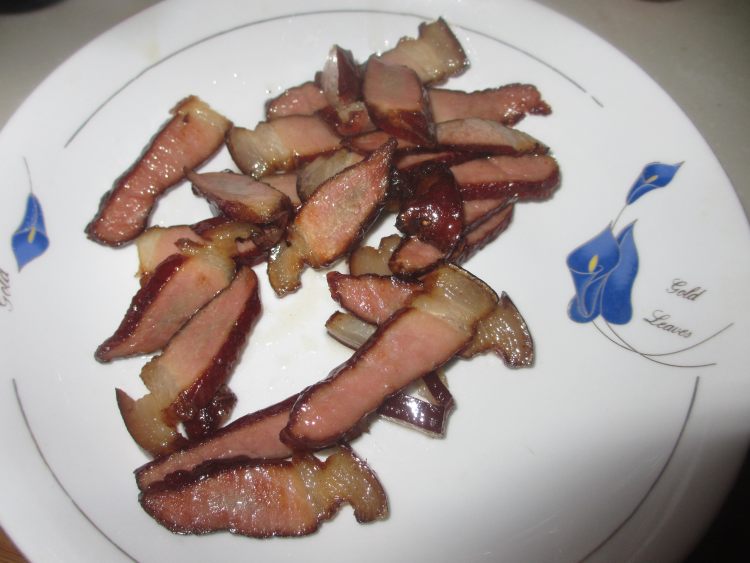 腊肉炒年糕步骤7