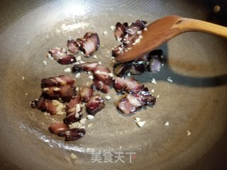 腊肉炒豆苗步骤7