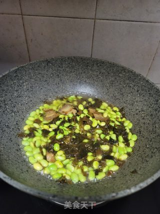 酸菜烧毛豆步骤6